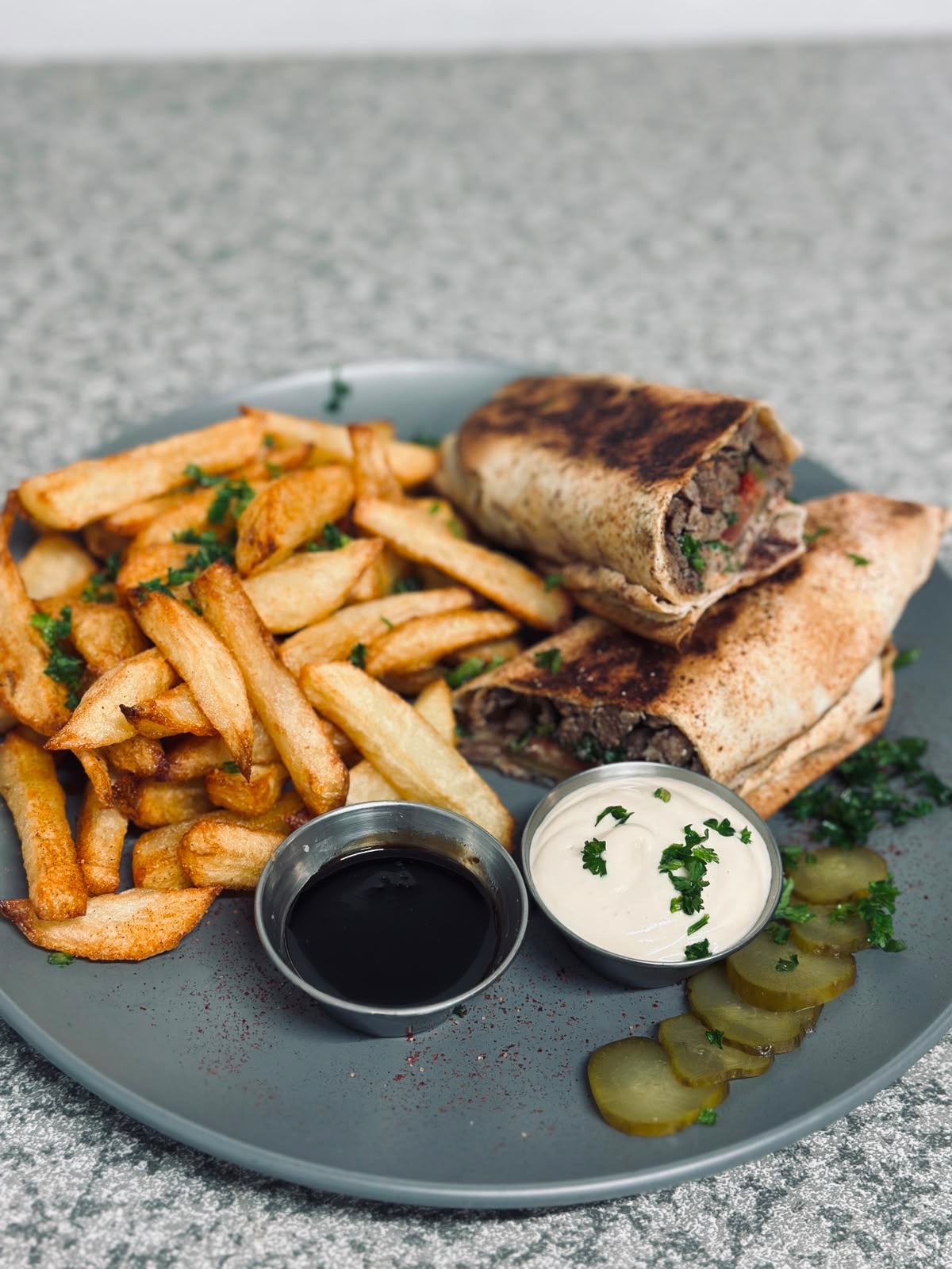 Beef shawarma wrap with fries and garlic sauce